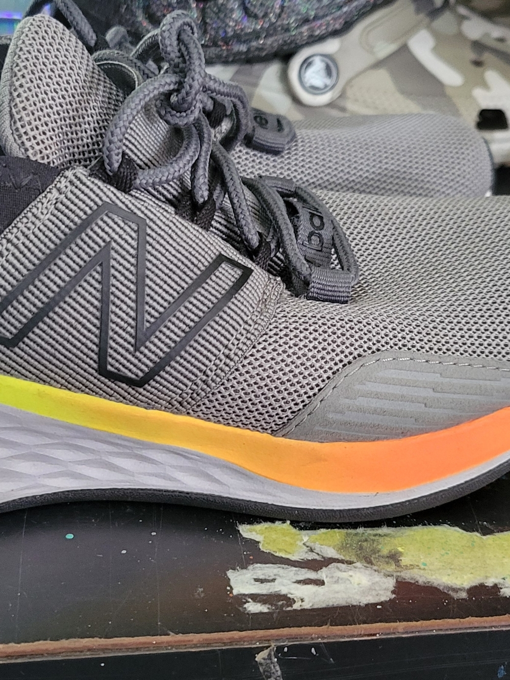 New Balance Men’s Gray Mesh Running Shoes with Yellow-Orange Accent